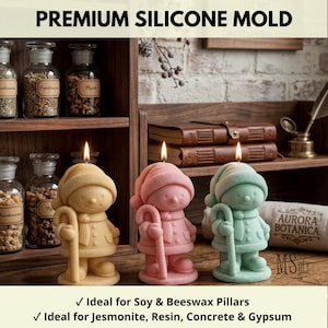 May include: Three silicone molds shaped like a child wearing a winter hat, scarf, and coat while holding a candy cane. The molds are yellow, pink, and light green. Text at the top reads PREMIUM SILICONE MOLD and at the bottom lists material uses.
