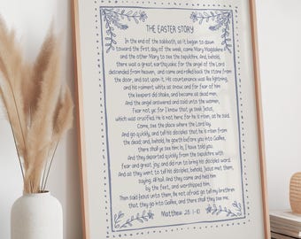 May include: A framed print with the text "THE EASTER STORY" in a decorative font. The text is a passage from Matthew 28:1-10, surrounded by a blue floral border. The frame is a light wood color.