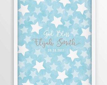 May include: A blue and white baby shower guest book with a white frame. The book has a watercolor background with white stars and the text "God Bless Elijah Smith 09.28.2017".