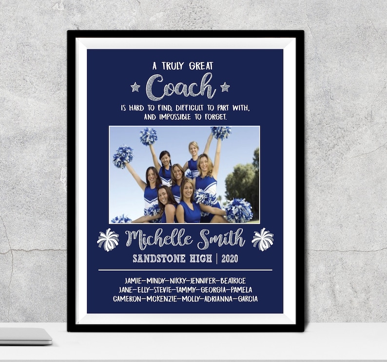 May include: Framed navy blue print with the text "A Truly Great Coach" and a photo of a cheerleading squad. The print includes the coach's name, school, and year, along with a list of names.
