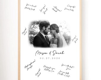 May include: A framed wedding photo featuring a black and white image of a couple. The names "Mason & Sarah" and the date "05.27.2026" are below the photo. Handwritten messages surround the image, including "You're loved!" and "Love you!"