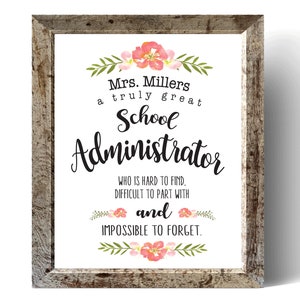 May include: A framed print with a floral design and the text "Mrs. Millers a truly great School Administrator WHO IS HARD TO FIND. DIFFICULT TO PART WITH and IMPOSSIBLE TO FORGET."