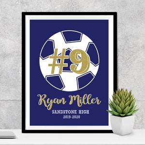 May include: A navy blue soccer print with a gold glitter #9 and the text "Ryan Miller Sandstone High 2019-2020".