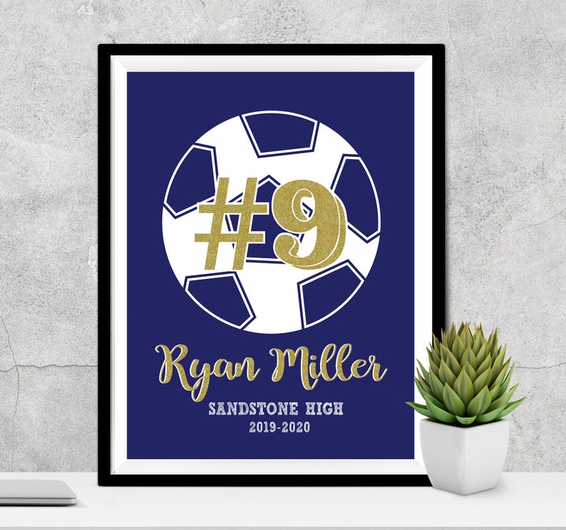 May include: A navy blue soccer print with a gold glitter #9 and the text "Ryan Miller Sandstone High 2019-2020".