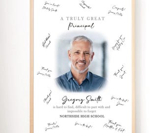 May include: A framed print with a light wood frame. The print features a photo of a smiling man in a blue shirt, surrounded by handwritten messages. Text reads "A Truly Great Principal" and "Gregory Smith".