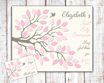 May include: A pink and gray tree with leaves for guests to sign their names on. The text reads "Elizabeth's First Holy Communion May God bless you. April 21, 2017".