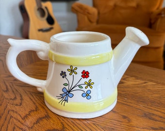 Small decorative ceramic watering pitcher,