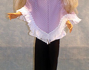 May include: A doll with long blonde hair, wearing a lavender knit poncho with white fringe and black pants. The doll is standing on a silver base, with black shoes.