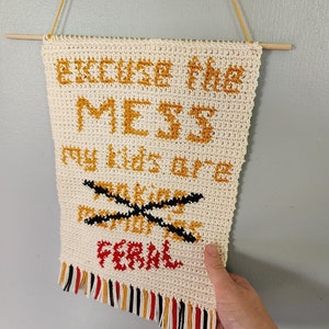 Crochet wall hanging; excuse the mess my kids are making memories; feral kids