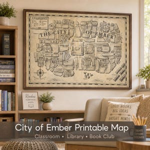 May include: A framed, rectangular wall map titled The City of Ember, rendered in black ink on a beige, parchment-style background. The map features detailed city blocks, a compass rose, a legend, and labels for various districts and landmarks.