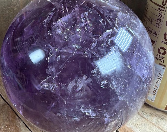 Brazilian amethyst sphere sale has imperfections , natural stone at may have pits and cracks  84mm 2.9 lbs
