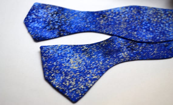 Navy Blue Glitter Print Bowtie, 100% polyester fabric. Pre-tied or self tie versions. adjusts to 21 inches with bowtie hardware.