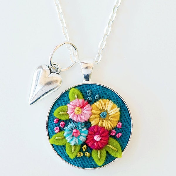Vibrantly Colored Hand Embroidered Necklace Pendant Jewelry - Hand Stitched Flowers on Teal Background - Silver Frame