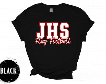 May include: Black t-shirt with the text "JHS Flag Football" in white with a red outline. The shirt is a Gildan brand and has a crew neck. The text is in a collegiate style font.