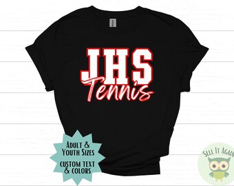 May include: Black t-shirt with white text that says "JHS Tennis" in red outlined letters. The text is in a bold, blocky font. The shirt is available in adult and youth sizes with custom text and colors.