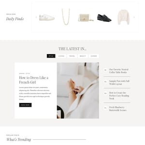 May include: A website homepage with the text "AMELIA JAMES" at the top. The page features sections on style, living, travel, and beauty, with articles on working from home and French girl style.