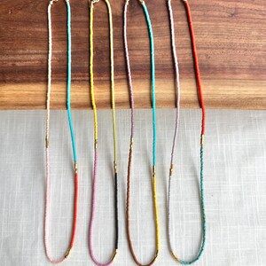 Wide shot of all 4 necklaces.
