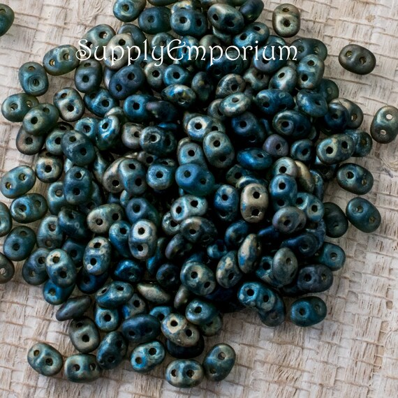 10g two hole tube beads two tone blue and copper.
