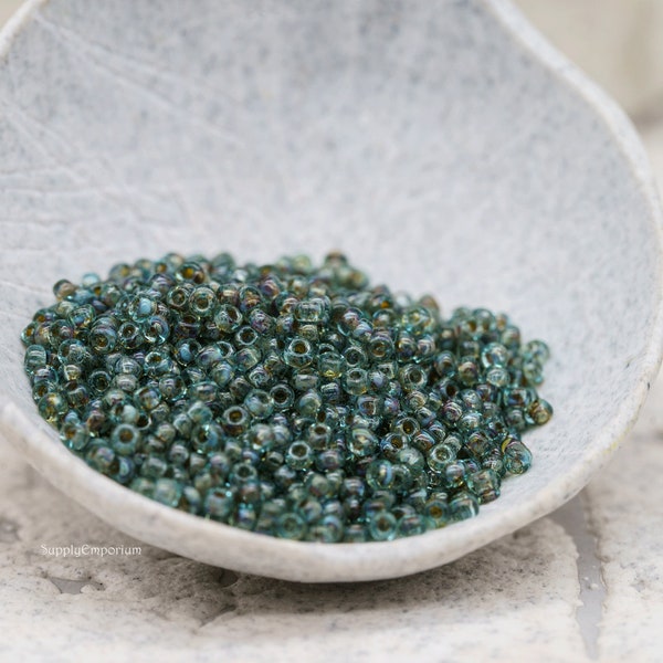 11/0 Transparent Olivine Picasso Miyuki Seed Beads. Miyuki 11-4506 Seed Beads. 10 grams. aka Miyuki 11/0 Seafoam Picasso Seed Beads. 1824