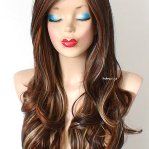 May include: Long, wavy brown wig with blonde highlights. The wig is styled with loose curls and falls to the shoulders.