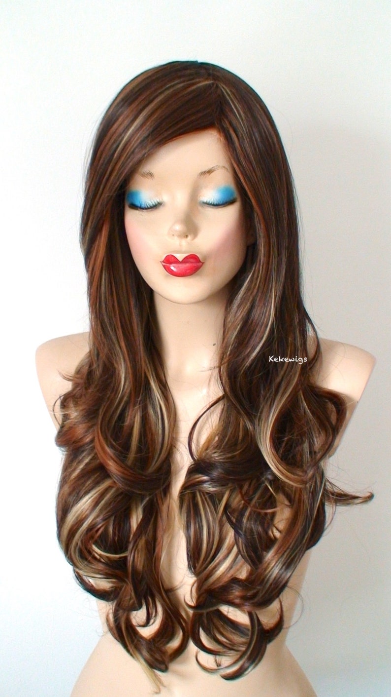 May include: Long, wavy brown wig with blonde highlights. The wig is styled with loose curls and falls to the shoulders.