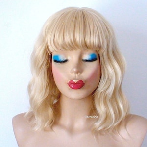 Blonde wig. 16&quot; Wavy wig with bangs. Heat friendly synthetic hair wig.