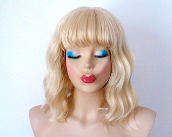 Blonde wig. 16" Wavy wig with bangs. Heat friendly synthetic hair wig.