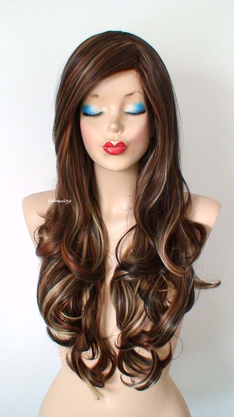 May include: Long, wavy brown wig with blonde highlights. The wig is styled with loose curls and falls to the shoulders.