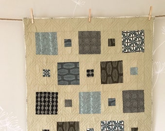 Scout Patches crib quilt in Parson Gray