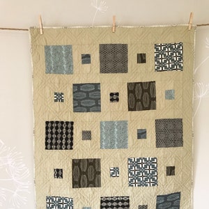 Scout Patches crib quilt in Parson Gray