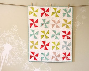 Pinwheels crib size quilt in Enchant prints