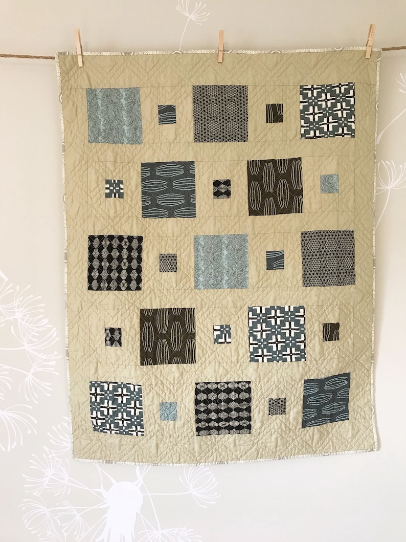 Scout Patches crib quilt in Parson Gray