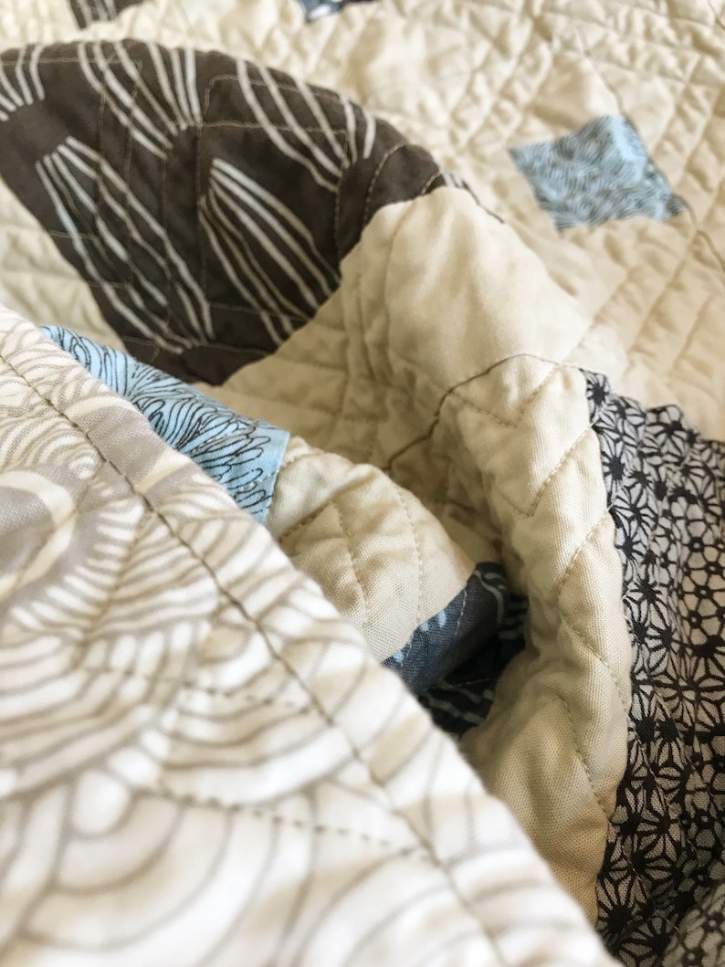 Scout Patches crib quilt in Parson Gray