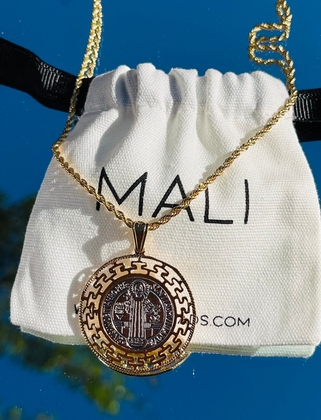 Supreme justice gold pendant best sale
