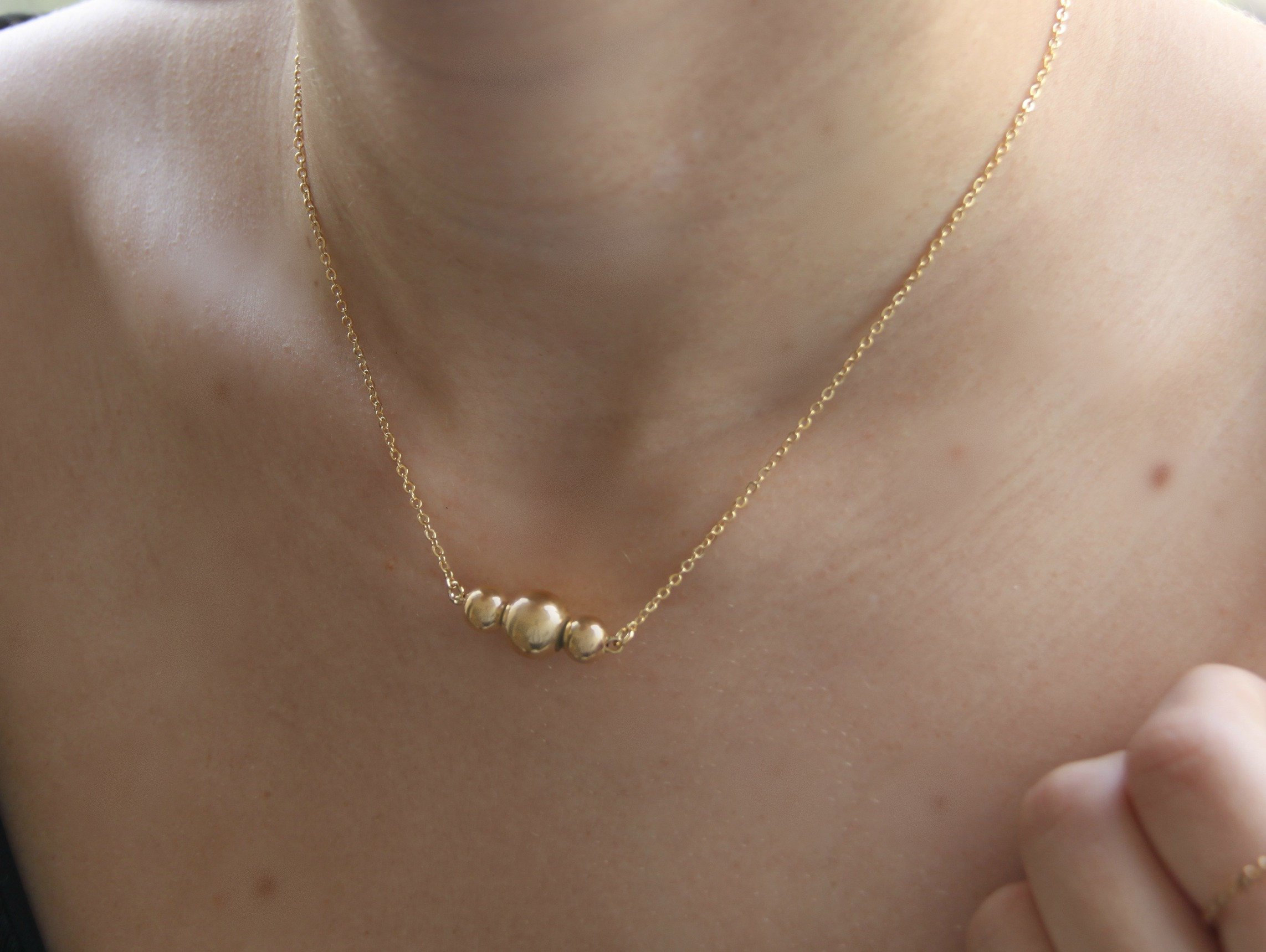 Simple gold ball necklace deals