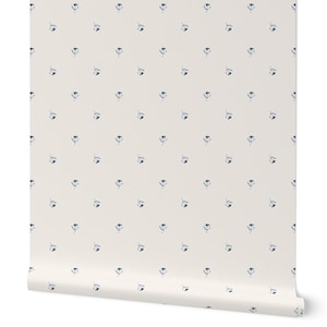 May include: White wallpaper with a repeating pattern of small blue floral designs.