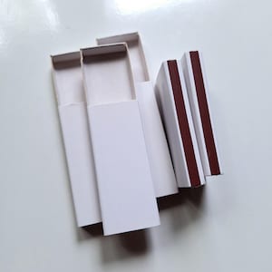 Cajas de cerillas de cartón blanco liso de 2,2" / vacías / con cerradero en un lado