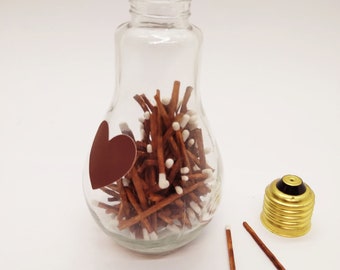 Matchstick holder, matchstick jar, striker on a side.