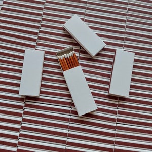 25 matchboxes, plain, striker from one side, brown cinnamon color stick, white heads, safety matches