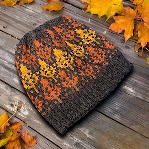 May include: A set of three ceramic mugs with a speckled, matte finish. The mugs are in shades of cream, light gray, and dark gray. Each mug has a simple, minimalist design, perfect for coffee or tea.