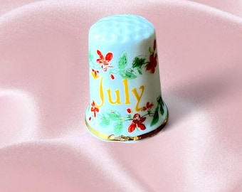 Vintage porseleinen vingerhoed juli | Fijn porselein, gouden afwerking