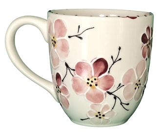 Large handmade ceramic coffee mug, hand painted with pink cherry blossoms.  It's large handle is comfortable and easy to hold. A great gift,