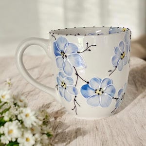 Large hand made ceramic mug, hand painted with a blue cherry blossom design.  It is 24 oz mug, teacher’s gift idea, gift idea