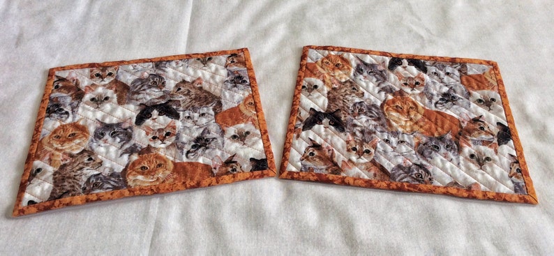 cats cats cats Xmas exchange gift set of 2 on a field of white gray and rust Cats galore cat snack mats mini cat placemats