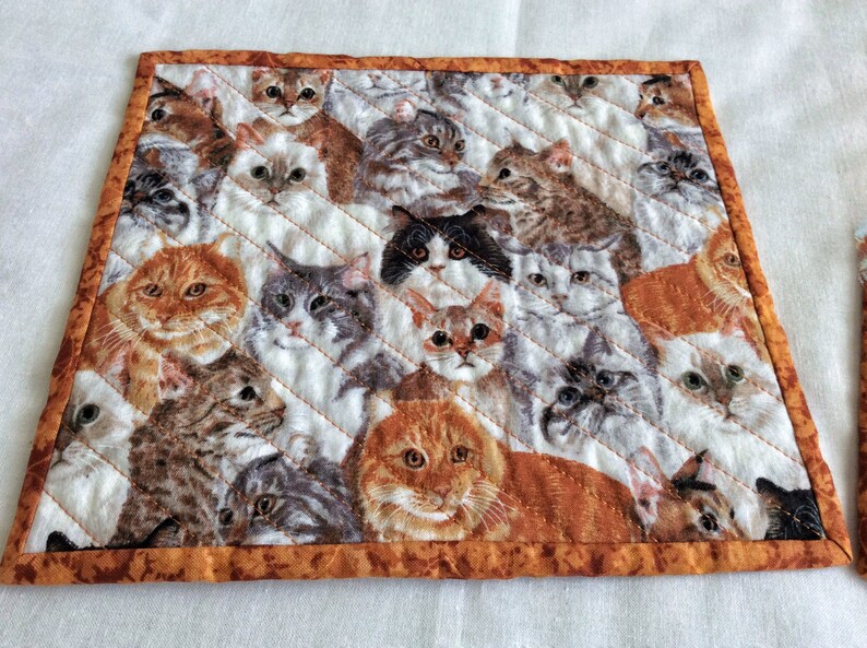 cats cats cats Xmas exchange gift set of 2 on a field of white gray and rust Cats galore cat snack mats mini cat placemats