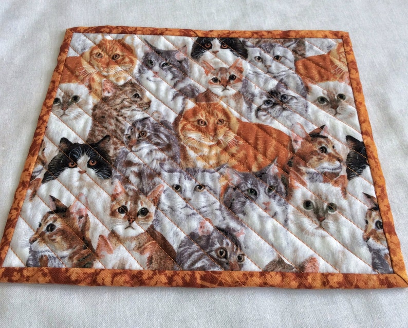 cats cats cats Xmas exchange gift set of 2 on a field of white gray and rust Cats galore cat snack mats mini cat placemats