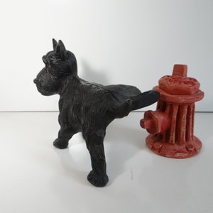 Vintage Black Cast Iron Scottie Dog and Red Resin Fire Hydrant - Peeing Scottish Terrier Cast Iron Dog with Red Resin Fire Hydrant
