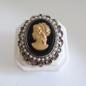 Victorian Style Cameo Brooch Pin with Gold Portrait on Black Background with White Seed Pearl Accents on Antiqued Gold Setting