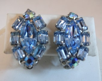 Weiss Blue Oval Shaped Rhinestone Clip Earrings with Blue Marquis Center Stone and Emerald Cut Surround Silver Tone Setting - Vintage Weiss