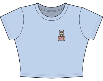 Camiseta infantil rosa con estampado de maleta de bulldog francés, ideal para regalar a amantes de los perros o a quienes viajan con ellos.